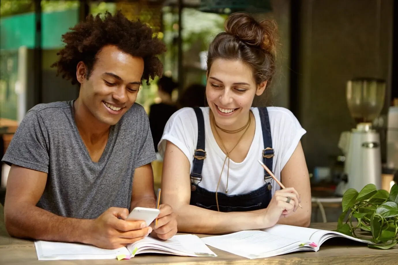 Friends studying together at a cafe