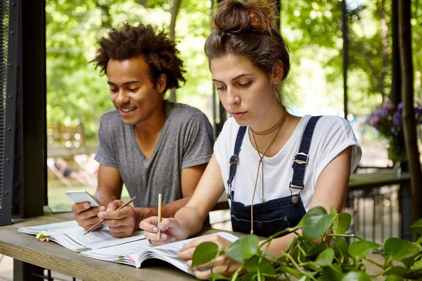 Friends studying together at a café